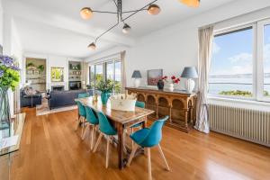 a dining room with a table and chairs at Villa heart of Evian swimming pool in Évian-les-Bains