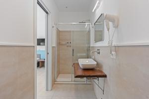 a bathroom with a sink and a shower at Boutique Suites 186 in Sorrento +116 photos