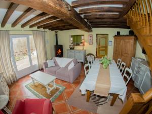 a living room with a table and a couch at Maison de charme à Lubine, idéale pour randonnées et famille, proche Alsace et stations de ski - FR-1-589-192 in Lubine