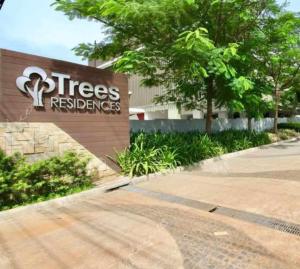 a tree reserves sign in front of a building at Trees Residences Staycation in Manila