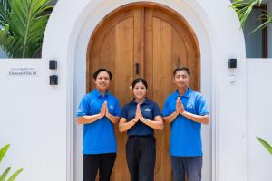 a group of three people standing in front of a door at Elements Villa B1 - Rooftop, Pool & 5-Min to Beach in Bingin Beach +48 photos