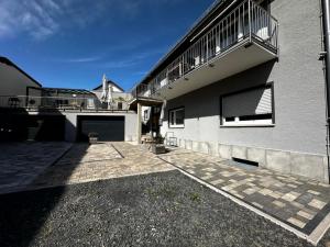 a house with a balcony on the side of it at casa ECH Ferienhaus Oberelsbach in Oberelsbach