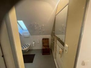 a bathroom with a sink and a toilet and a window at Loft Steingasse in Bad Neustadt an der Saale