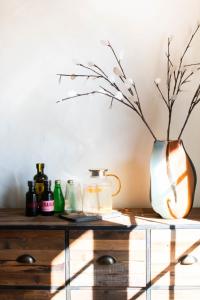 a wooden table with a vase on top of it at Villa des Landes in Seignosse +22 photos