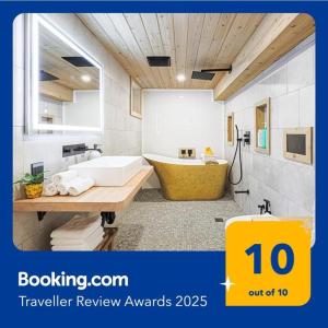 a large bathroom with a tub and a sink at Spa Oasis in Toronto's Heart-Free Parking! and Pet Friendly in Toronto