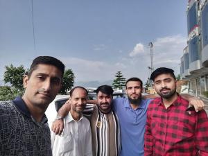 a group of men standing next to each other at GC Hotel & Banquet Hall in Dargai