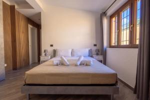 a bedroom with a bed with two pillows on it at Il Piccolo Borghetto in Rome