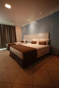 Ένα ή περισσότερα κρεβάτια σε δωμάτιο στο Ita Park Hotel