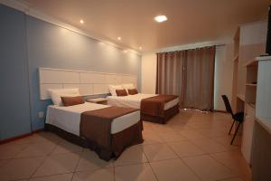 Ένα ή περισσότερα κρεβάτια σε δωμάτιο στο Ita Park Hotel