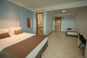 Ένα ή περισσότερα κρεβάτια σε δωμάτιο στο Ita Park Hotel