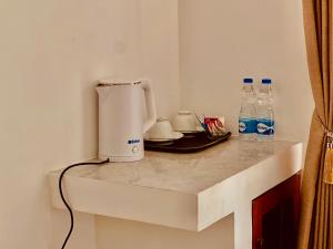 Příslušenství pro přípravu čaje a kávy v ubytování K T Resort - Ahangama