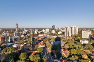 an aerial view of a city with tall buildings at Just 100 meters from Shopping del Sol in Asuncion