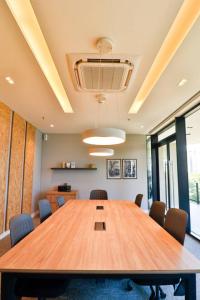 a conference room with a large wooden table and chairs at Just 100 meters from Shopping del Sol in Asuncion +18 photos