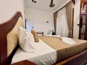 Postel nebo postele na pokoji v ubytování K T Resort - Ahangama