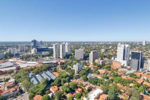 an aerial view of a city with tall buildings at Stylish Retreat Steps from Shopping del Sol in Asuncion