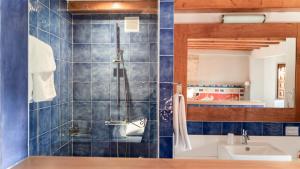 a bathroom with a shower and a sink at Hotel El Cerco in Puente la Reina +21 photos