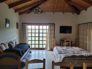 Ένα ή περισσότερα κρεβάτια σε δωμάτιο στο Apart hotel Las golondrinas