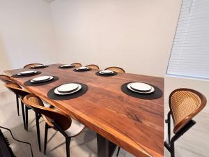 a wooden table with chairs around it in a room at Bora Bora in Casa Grande