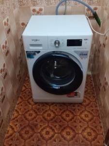 a washer and dryer in a bathroom at Christos in Asvestokhórion