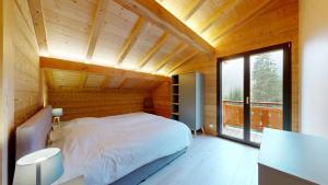 Ένα ή περισσότερα κρεβάτια σε δωμάτιο στο Chalet La Frenaie FRN NATURE & MODERN 10 Pers