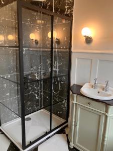 a bathroom with a shower and a sink at The Saltburn Townhouse in Saltburn-by-the-Sea +3 photos