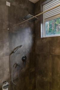 een badkamer met een douche met een douchekop bij Joalis Villa Polhena Ltd in Matara +40 foto's