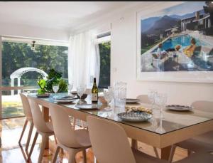 a dining room with a table and chairs at The Pond House Trentham in Trentham