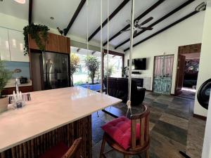 a kitchen with a large island in a room at Casa Bali in San Francisco de Palmera