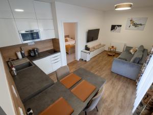 Kuchyň nebo kuchyňský kout v ubytování Apartments Severka - Jasná