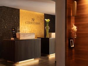 a lobby with a vase of flowers on a wall at Cerretani Hotel Firenze - MGallery Collection in Florence