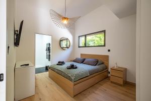 a bedroom with a large bed and a window at Villa Loki - A 700m de la mer ! in Locquirec +54 photos