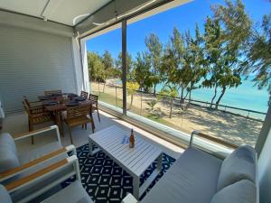 a living room with a view of the ocean at Seaside Escape with Breathtaking View in Grand Gaube