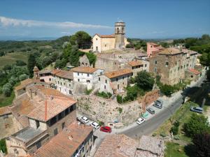 an aerial view of a town with a castle at In Borgo -Legoli in Peccioli