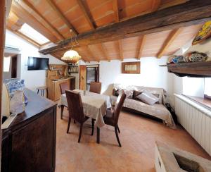a living room with a table and a couch at In Borgo -Legoli in Peccioli