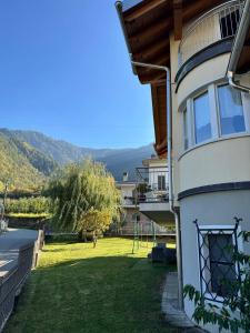 a house with a yard with a playground in it at Il Nido di Adele in Sernio
