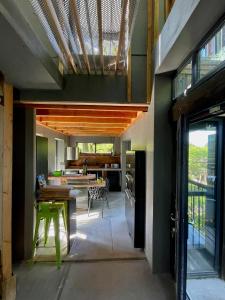 an open kitchen and dining room of a house at Zero Zero Treehouse in Coleford