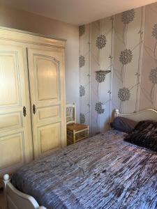 a bedroom with a large bed in a room at Maison de vacances in Ramous