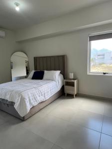 Llit o llits en una habitació de Depa con Cocina, Sala, Comedor y Alberca