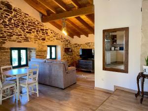 a living room with a couch and a table at Casa Veracruz Sanabria in Puebla de Sanabria