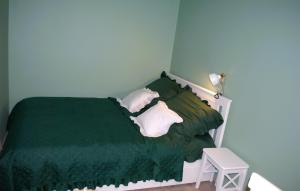 En eller flere senge i et værelse på Apartament Staromiejski