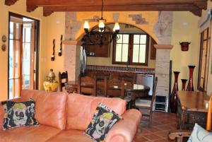 a living room with a couch and a table at Casa Mar de Cortez in Loreto