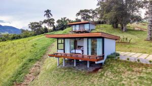 a small house on top of a hill at Cabanas verde montaro in Santo Antônio do Pinhal