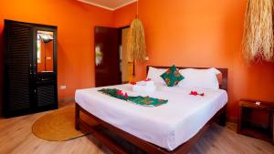 Giường trong phòng chung tại Coconut Breeze Apartments +12 ảnh