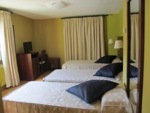 Postel nebo postele na pokoji v ubytování Hotel De Rei