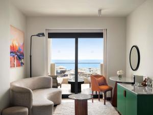 a living room with a view of the ocean at Hotel Novotel Sharm El-Sheikh in Sharm El Sheikh