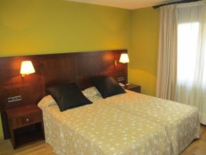 Postel nebo postele na pokoji v ubytování Hotel De Rei