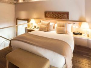 Ένα ή περισσότερα κρεβάτια σε δωμάτιο στο Sofitel Legend Santa Clara Cartagena