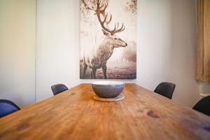 a wooden table with a bowl on top of it at Acceso Directo a Grandvalira I Ski, Vistas y Relax I Cabirol in Sant Pere