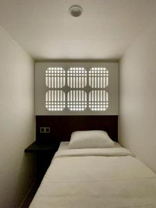 Ένα ή περισσότερα κρεβάτια σε δωμάτιο στο Hotel Myeongdon Station +29 φωτογραφίες