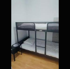 a couple of bunk beds in a room at Casa da Tia Binda - refúgio no centro histórico in Monção